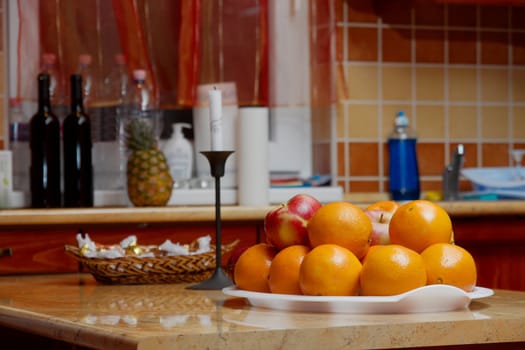 Kitchen table with a pile of oranges