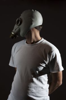 a man wearing a gas mask environment danger concept image