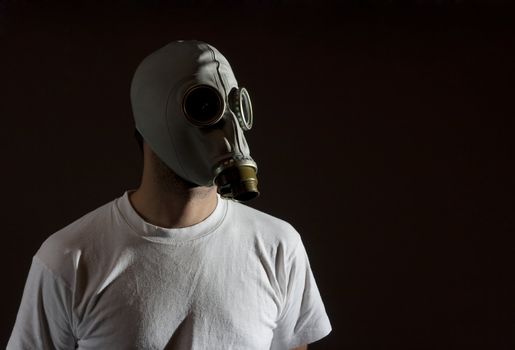 a man wearing a gas mask environment danger concept image