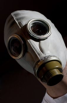 a man wearing a gas mask environment danger concept image