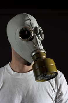 a man wearing a gas mask environment danger concept image