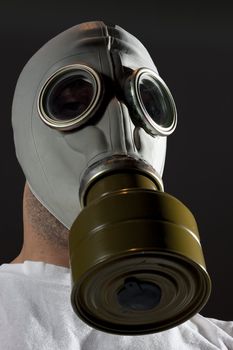 a man wearing a gas mask environment danger concept image