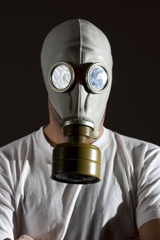 a man wearing a gas mask environment danger concept image