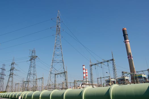 Electric power station against clear blue sky