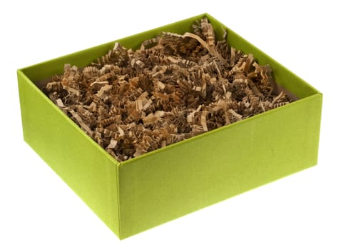 ecological gift box covered by green fabric, filled with recycled shreded brown paper as packing material, isolated on white with clipping path