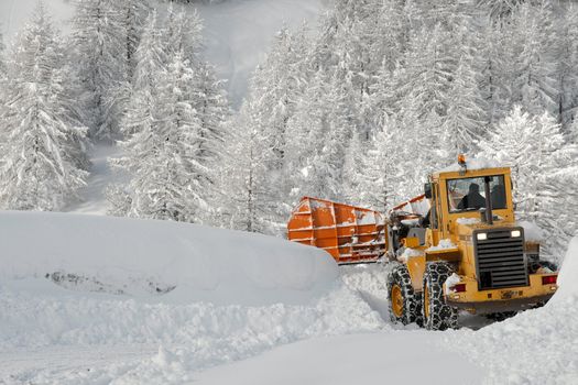 Removing snow from a road in winter