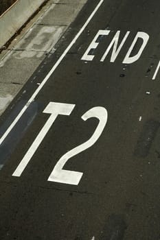 road and pavement detail, white line and text 'END T2'