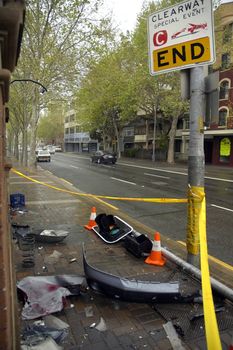 parts of car and traffic light after crash, END sign, we road 