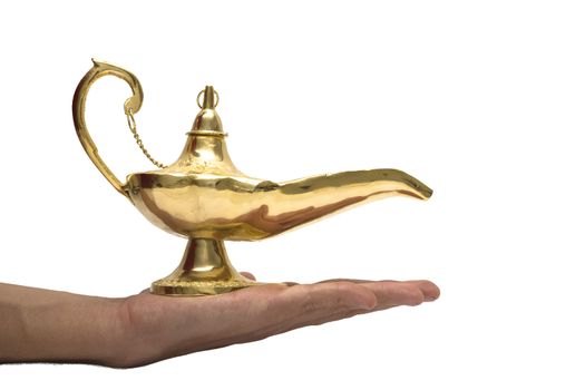 An arabic magic lamp on a persons hand, isolated on white.