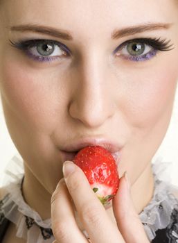 Beautyfull girl with strawberry in her mouth