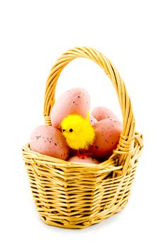 small basket with eggs and a eastern chicken isolated on white