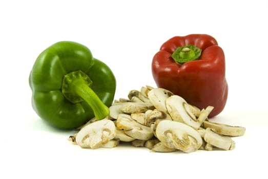 Two bell peppers and sliced champignon mushrooms isolated on white background