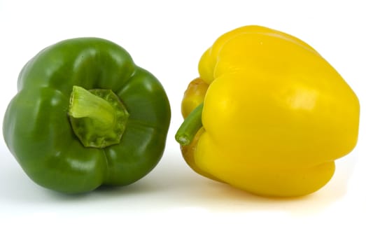 Yellow and green bell peppers isolated on white background