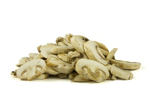 A pile of sliced champignon mushrooms isolated on white background.
