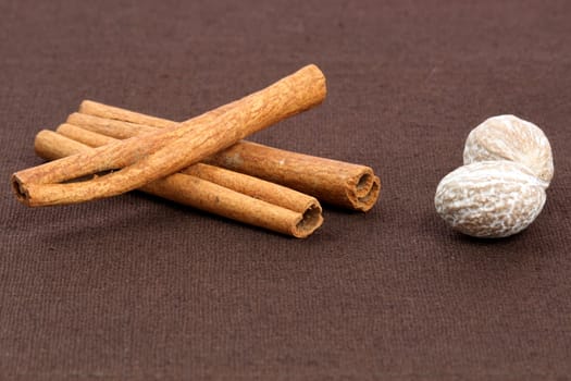 fancy cinnamon sticks and nutmeg delicious baking and cooking ingredients   