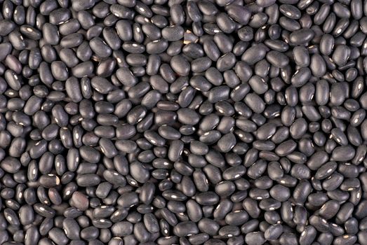 Background of dry black beans, south american frijoles