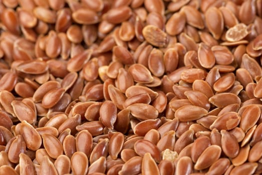 A heap of organic linseed, food background