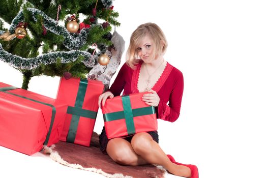 Happy woman with Christmas presents and tree isolated on white