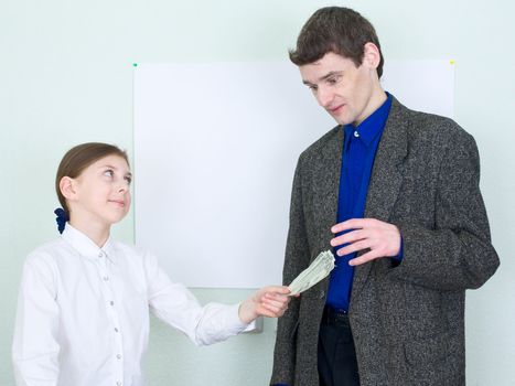 Girl stretches money to the guy in a suit