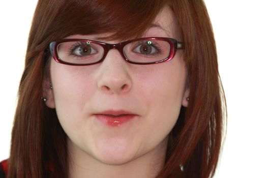 Portrait of young beautiful female teenager in glasses isolated on white background