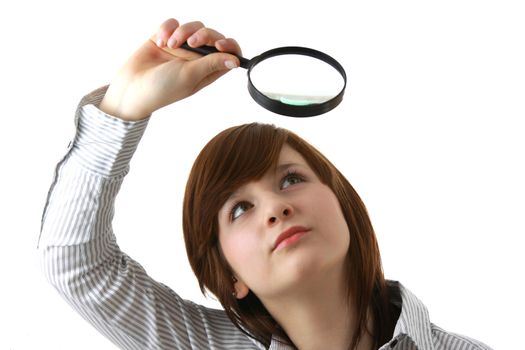 Young student with magnifier isolated on white background