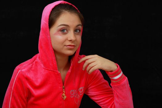 Zoung girl in pink portrait isolated on black