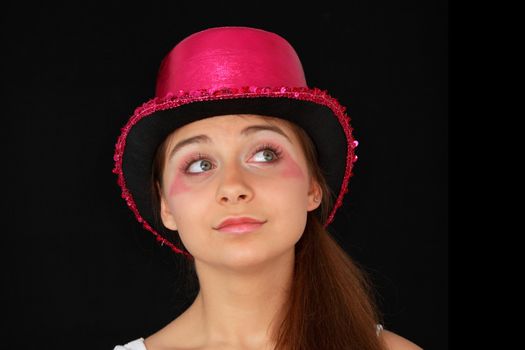 Portrait of a beautiful young girl in pink disco hat - carnival theme