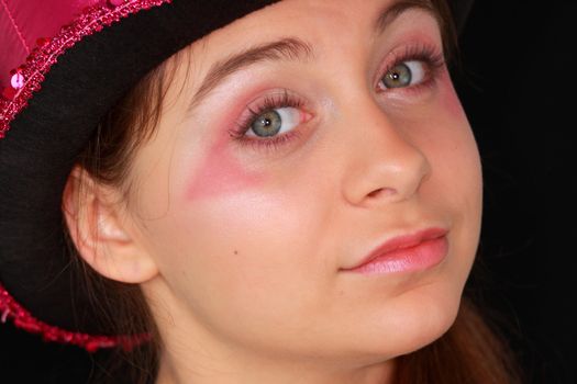 Portrait of a beautiful young girl in pink disco hat - carnival theme