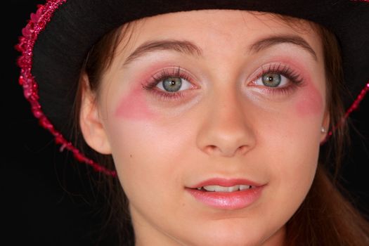 Portrait of a beautiful young girl in pink disco hat - carnival theme