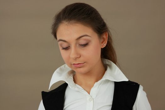 Student girl over light brown background