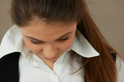 Student girl over light brown background