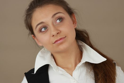 Student girl over light brown background