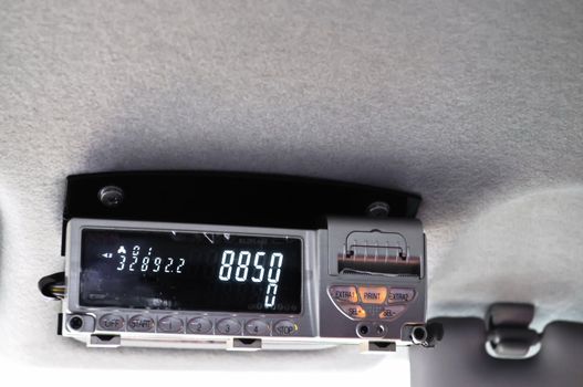 Taxi meter in a foreign cab during a trip