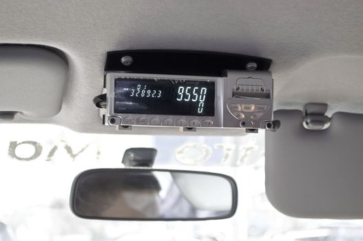 Taxi meter in a foreign cab during a trip