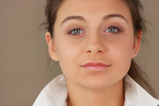 Student girl over light brown background