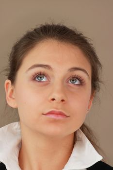 Student girl over light brown background