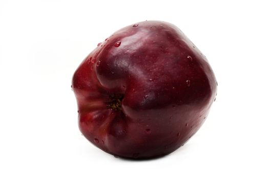 Red apple in dewdrop insulated on white background