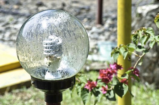 Big condensed ball lamp in a public garden