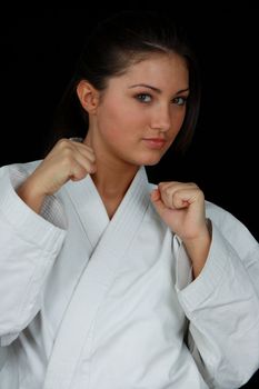 Beautiful young teen in karate suit