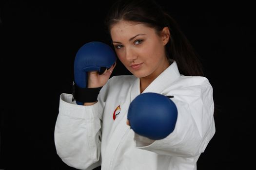 Beautiful young teen in karate suit