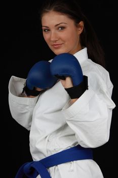 Beautiful young teen in karate suit