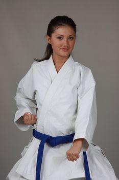 Beautiful young teen in karate suit