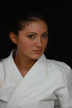 Beautiful young teen in karate suit