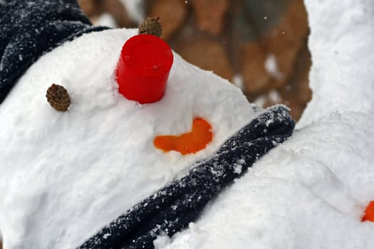 Freezen snowman with cup and scarf