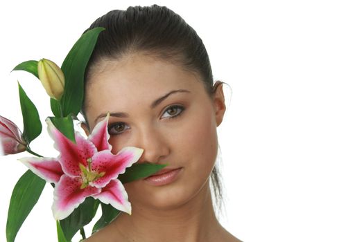 Portrait of young attractive woman with beautiful lilly flower