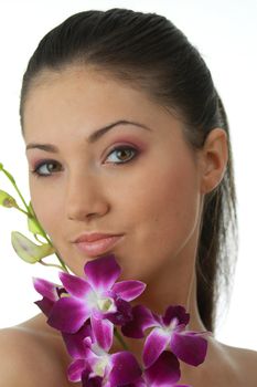 Beauteful spa girl with orchid isolated on white background