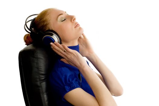 Redhead woman with headphones over white listenning