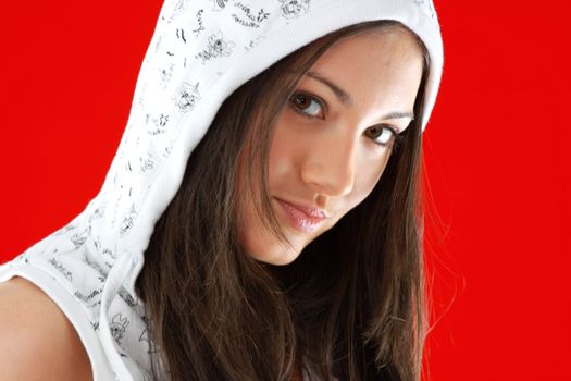 Young sexy girl portrait over red background