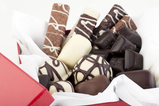 Assortment of gourmet chocolates in gift box.