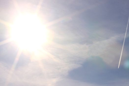 sunny sky background with cloud and little plane